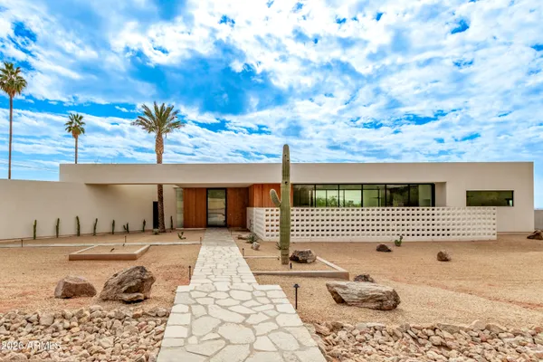 a outdoor space with lots of tables and chairs