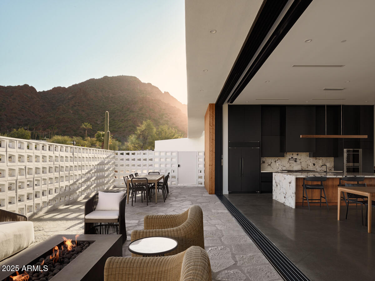 4905 East White Gates Drive Phoenix, AZ 85018 - Photo 5 of 11 a dining room with furniture and wooden floor