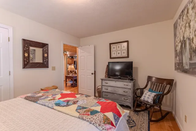 a very nice looking room with a large window and glass door