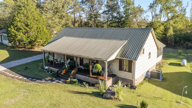 a view of a house with backyard tub and wooden fence