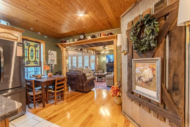 a living room with furniture flower pot and a fireplace