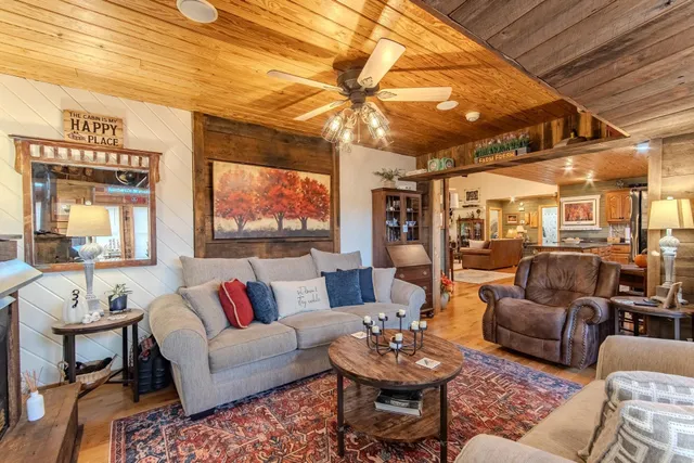 a front view of a house with barbeque and wooden floor