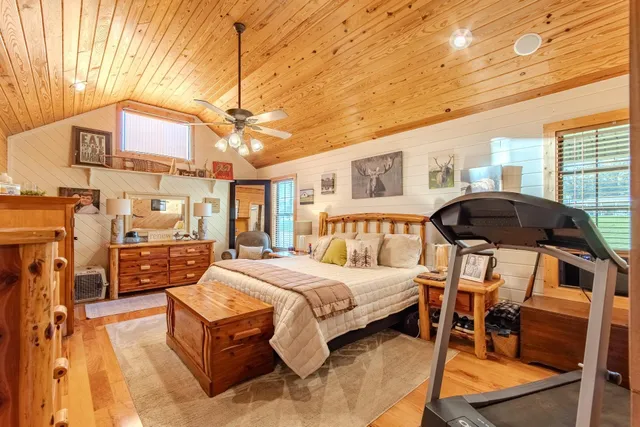 a bed room with a bed and a chandelier