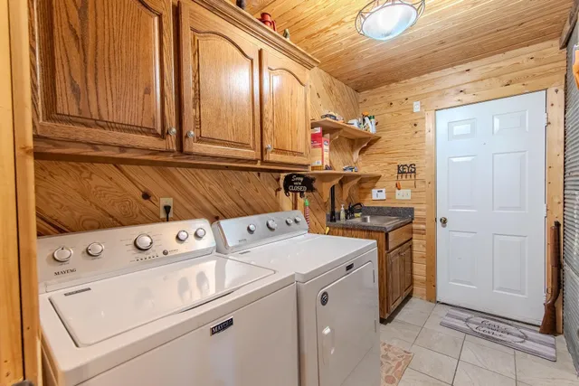 a view of a balcony with chairs and wooden floor