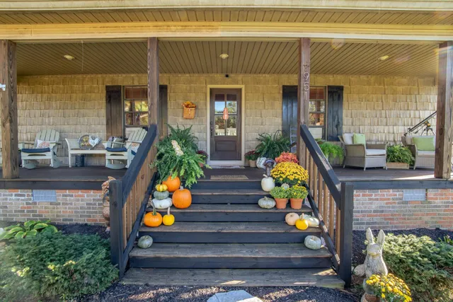 a hallway with wooden floor table and chairs