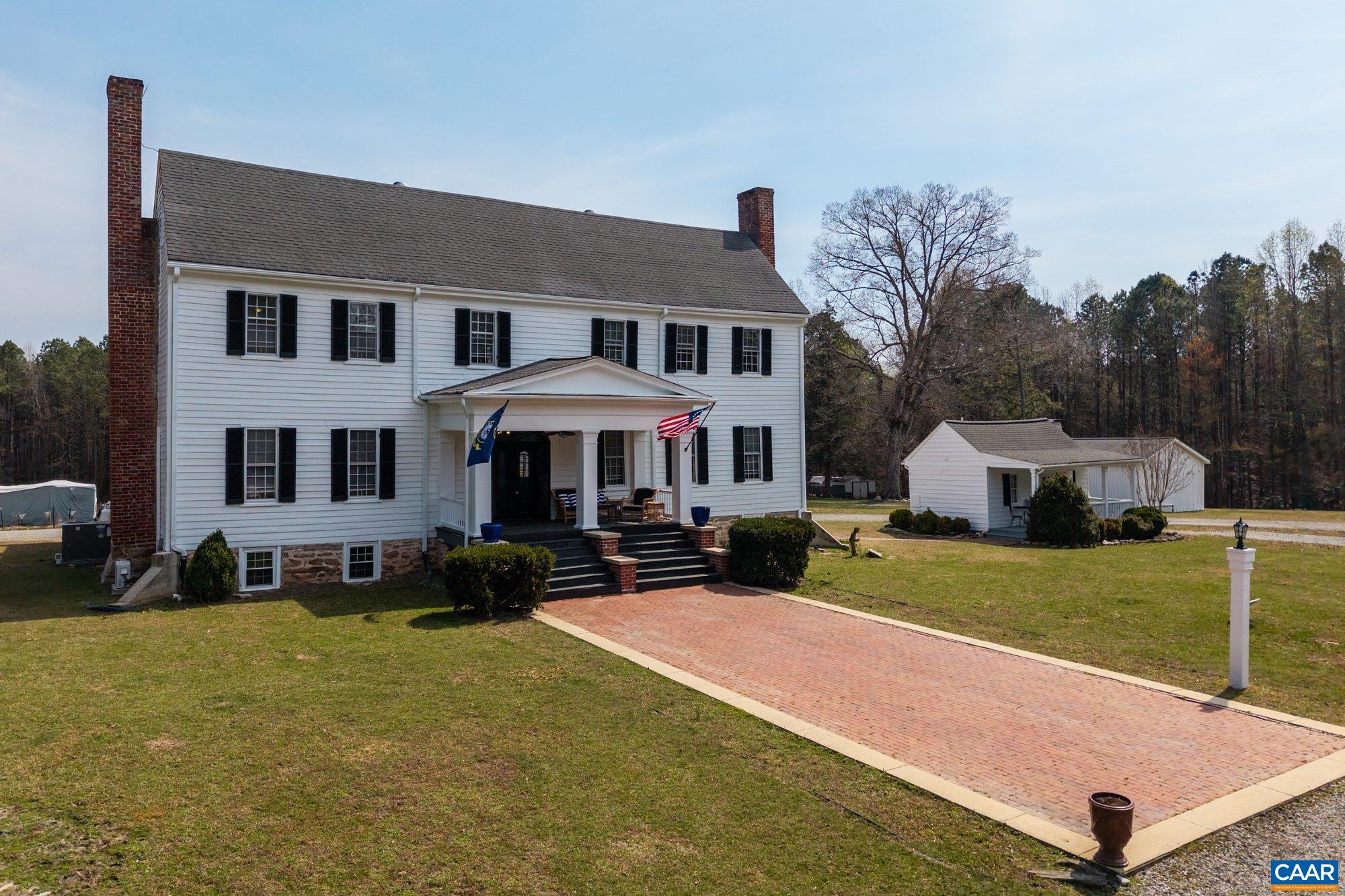 14910 Western Mill Road Lawrenceville, VA 23868 - Photo 3 of 73 a front view of a house with garden