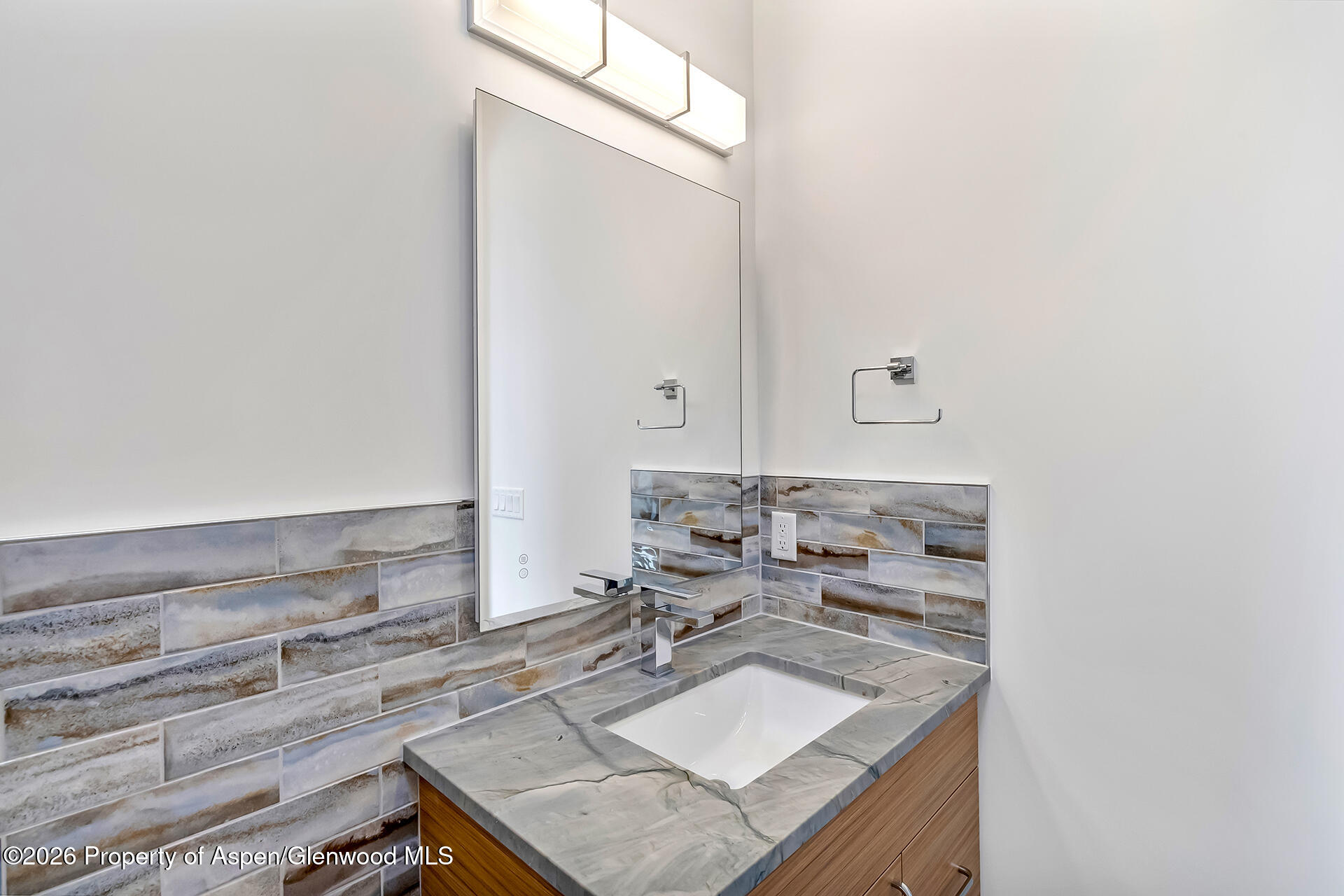 2216 Rimrock Road Grand Junction, CO 81507 - Photo 42 of 84 a bathroom with a sink and a mirror
