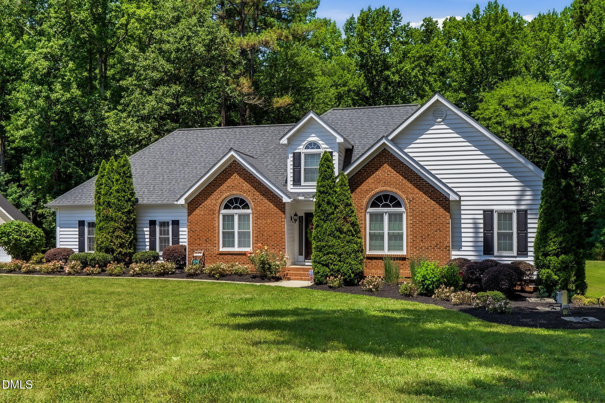 1112 Tyler Farms Drive Raleigh, NC 27603 - Photo 5 of 78 a front view of a house with a yard and green space