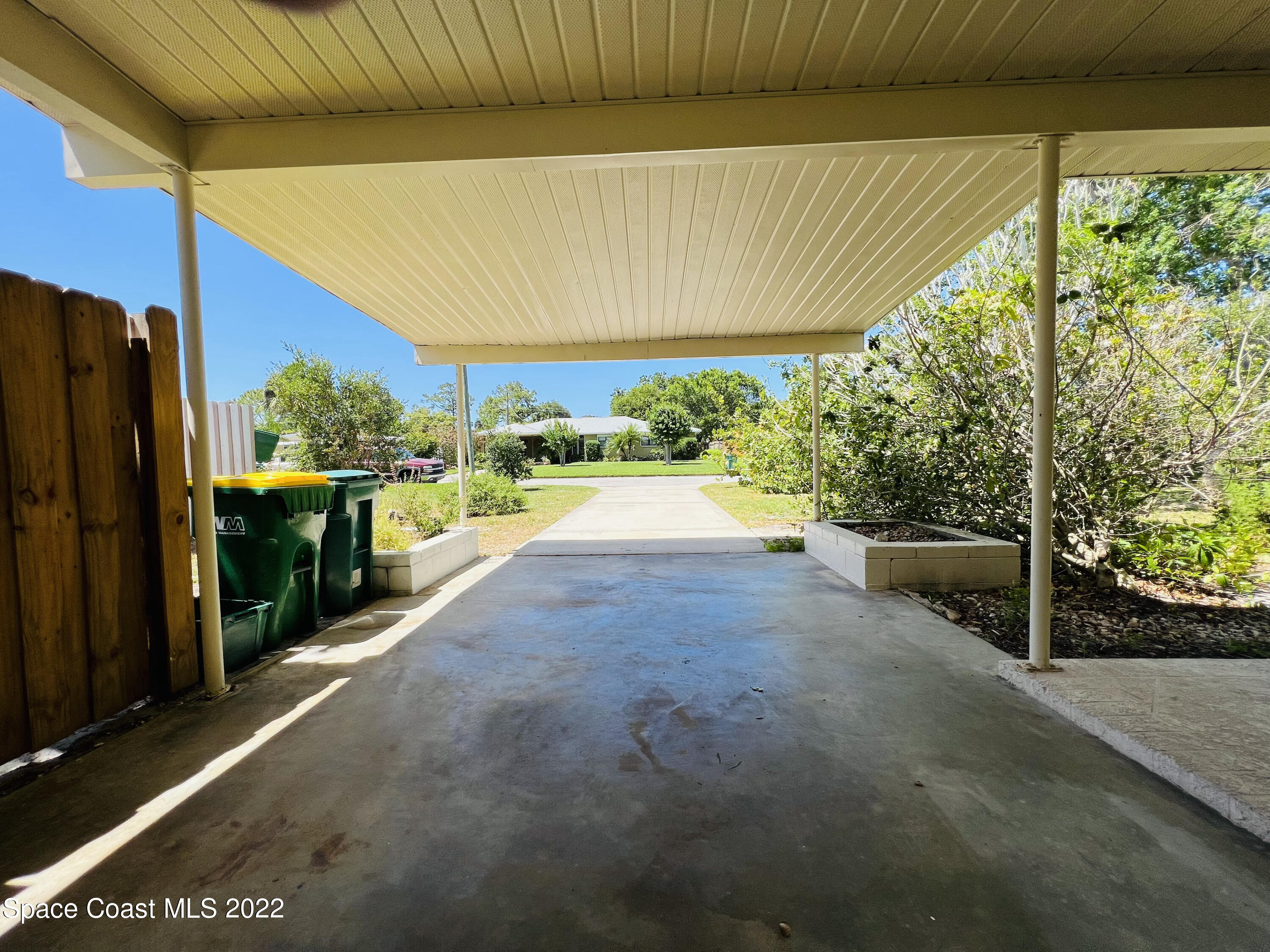 1207 Duke Way Cocoa, FL 32922 - Photo 4 of 37 a view of a patio with table and chairs under an umbrella