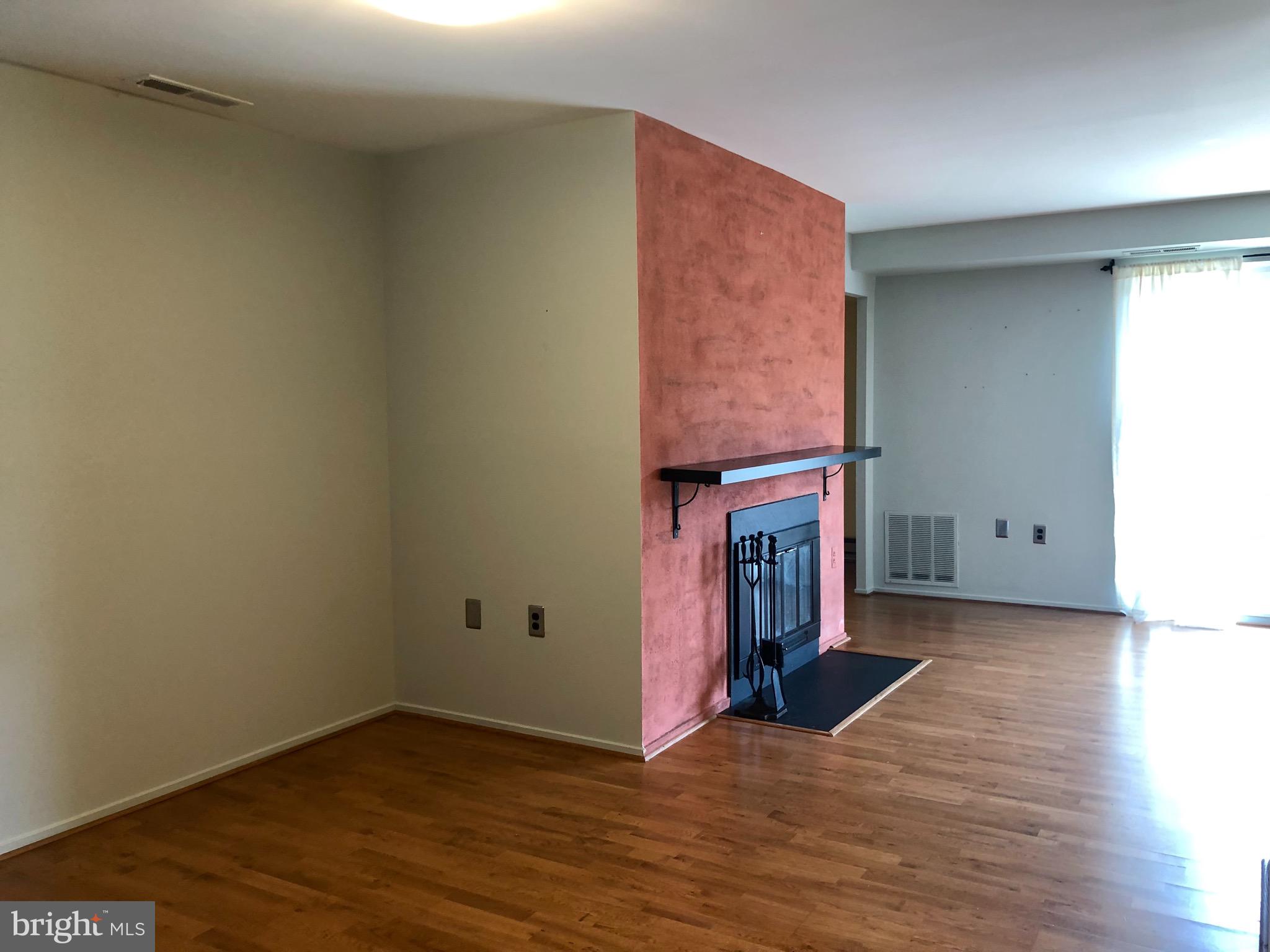 10000 Stedwick Road, Unit 204 Gaithersburg, MD 20886 - Photo 17 of 27 Dinning Room Fireplace