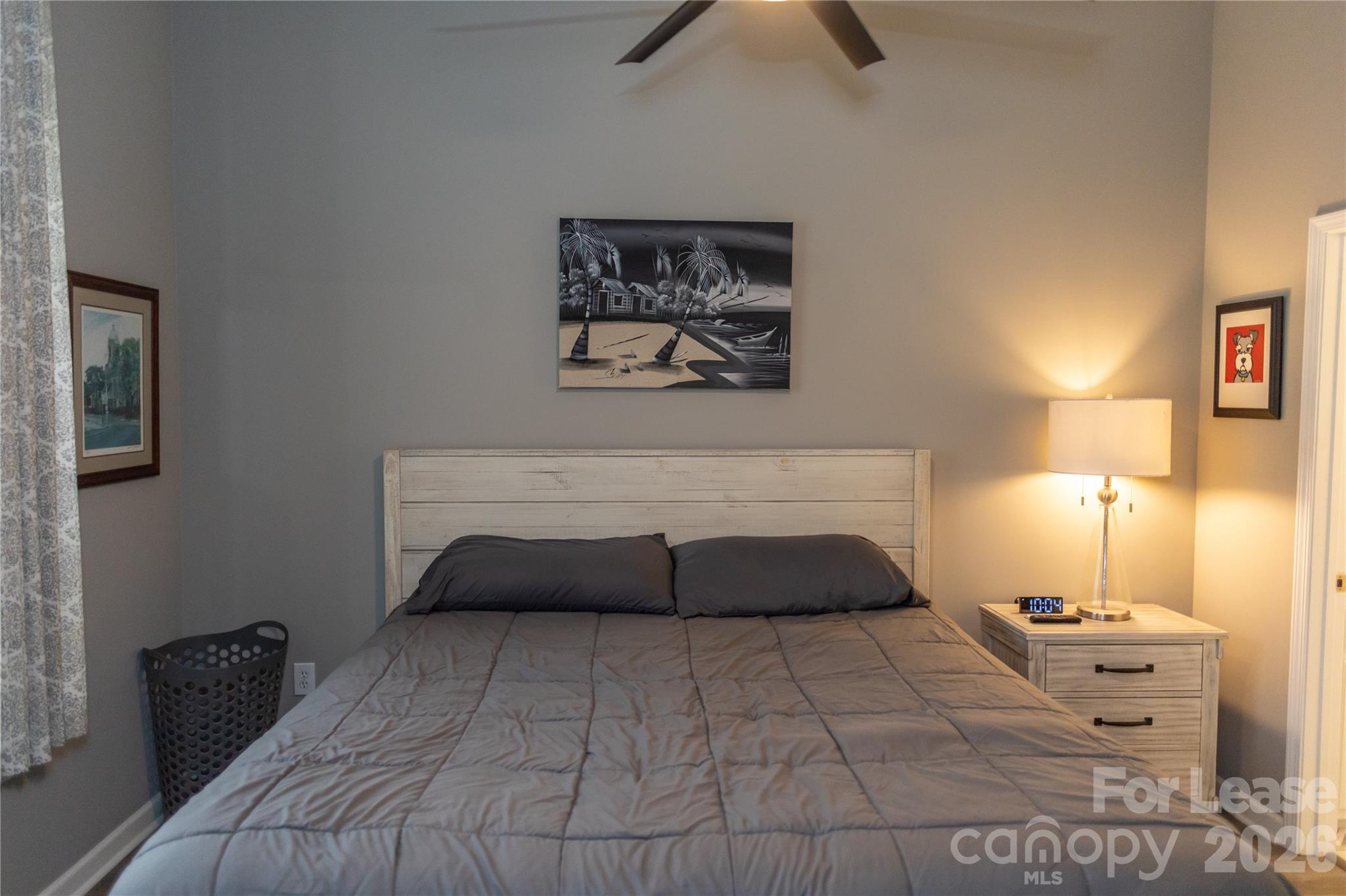 107 White Street, Unit B Morganton, NC 28655 - Photo 2 of 18 a bedroom with a bed and a lamp on dresser