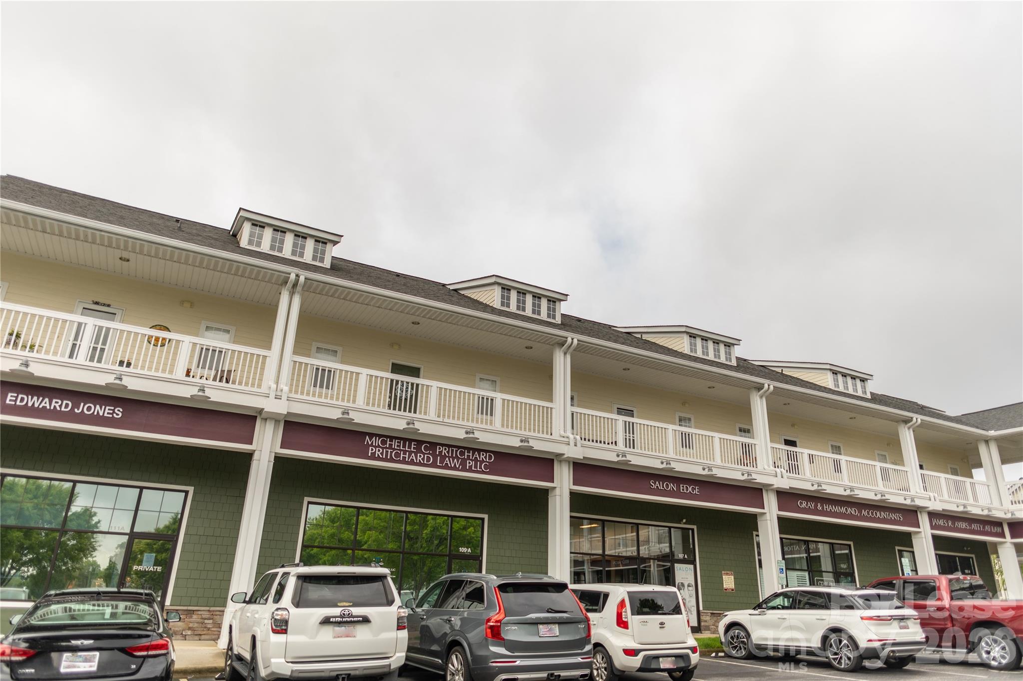 107 White Street, Unit B Morganton, NC 28655 - Photo 4 of 18 a front view of building with cars parked