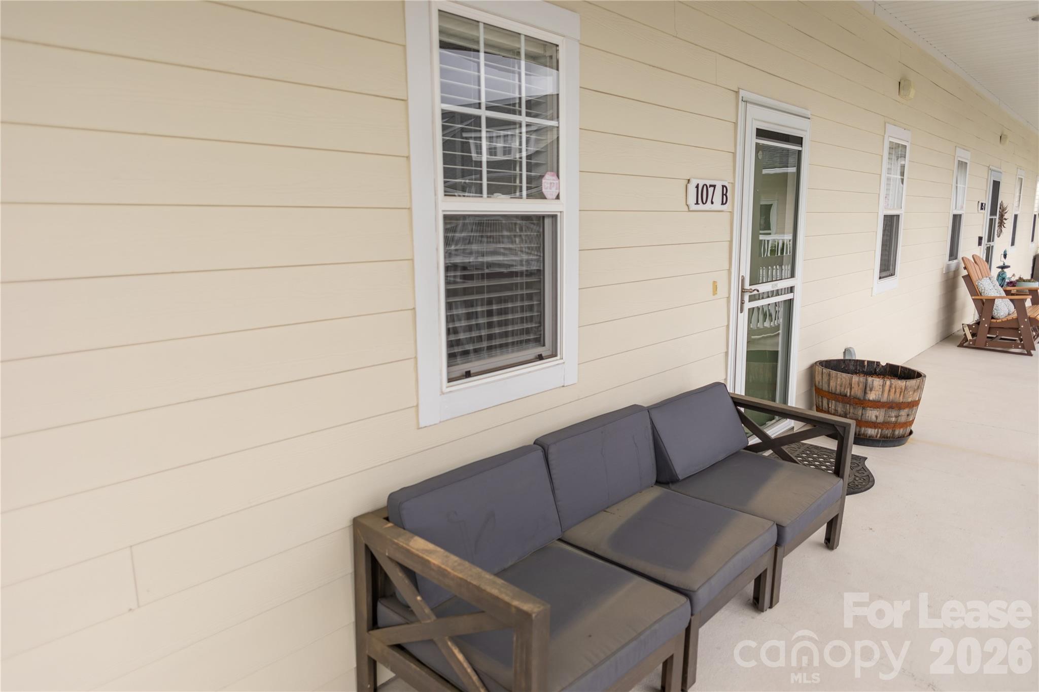107 White Street, Unit B Morganton, NC 28655 - Photo 6 of 18 a outdoor living space with furniture and a window