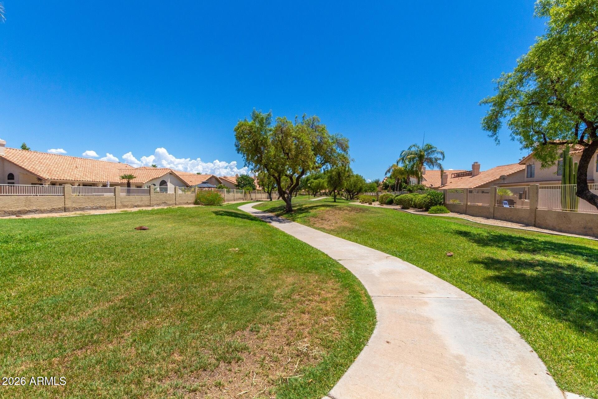 1434 West Key Harbor Drive Gilbert, AZ 85233 - Photo 105 of 144 a view of a garden with a building in the background