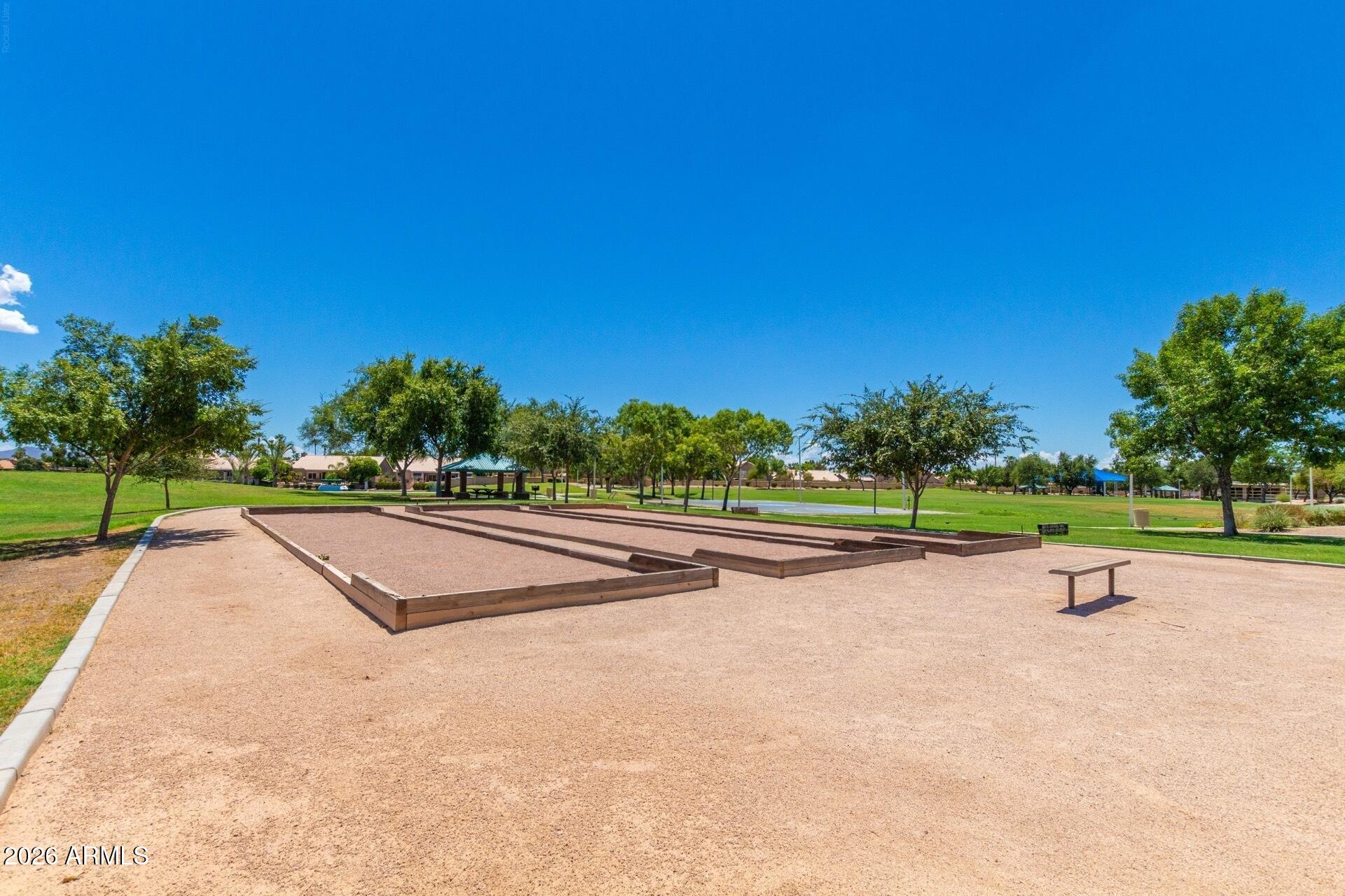 1434 West Key Harbor Drive Gilbert, AZ 85233 - Photo 109 of 144 a view of a swimming pool and trees in the background