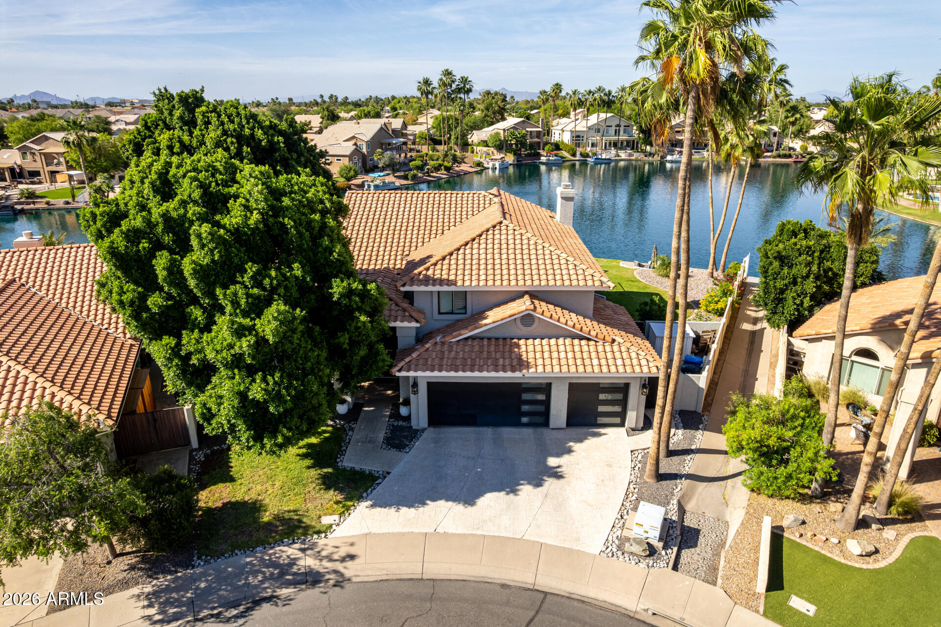 1434 West Key Harbor Drive Gilbert, AZ 85233 - Photo 2 of 144 a front view of a house with a yard and a garden