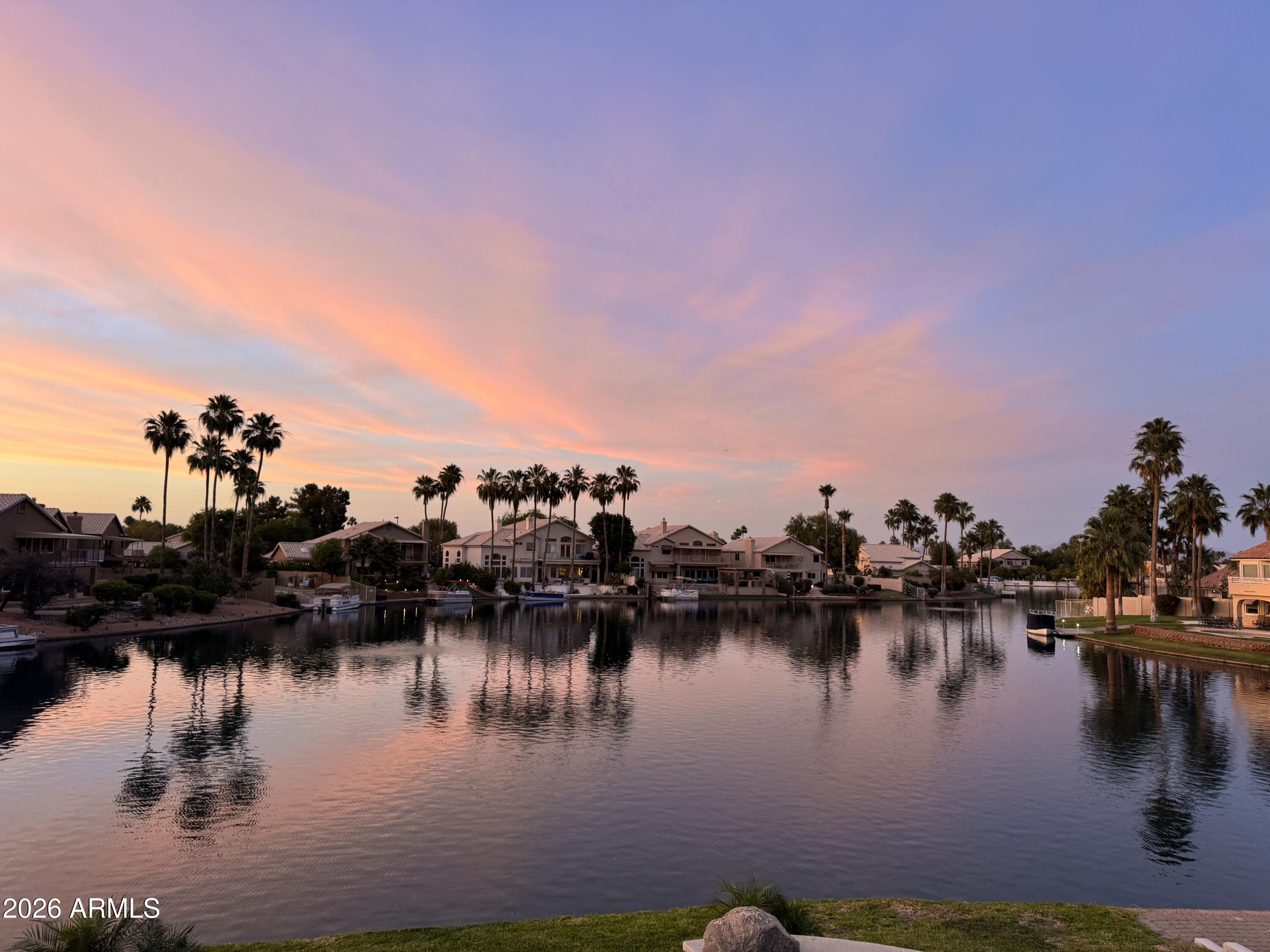 1434 West Key Harbor Drive Gilbert, AZ 85233 - Photo 35 of 144 a view of a lake with boats and trees in the background