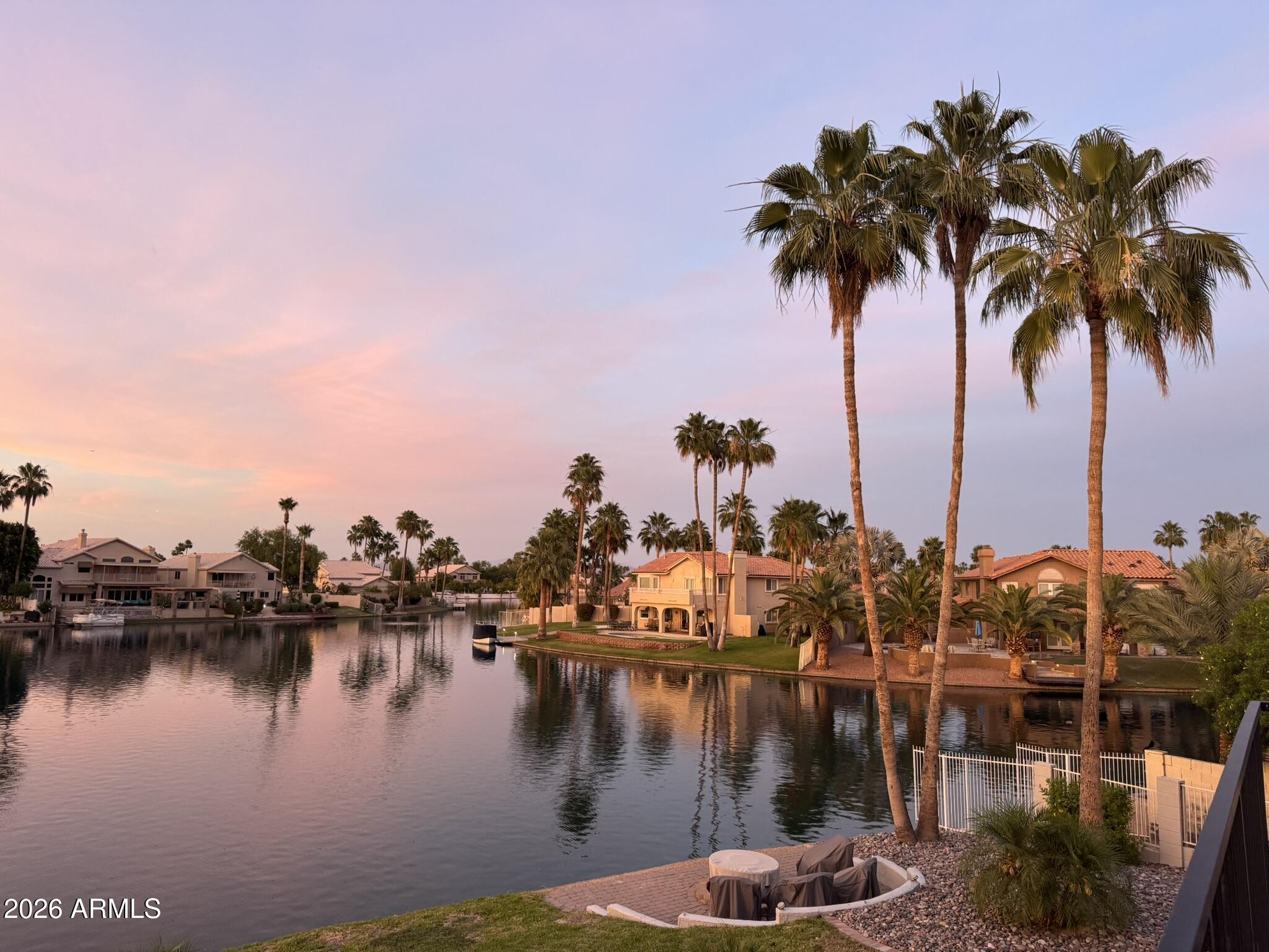 1434 West Key Harbor Drive Gilbert, AZ 85233 - Photo 36 of 144 a view of a lake with boats and palm trees
