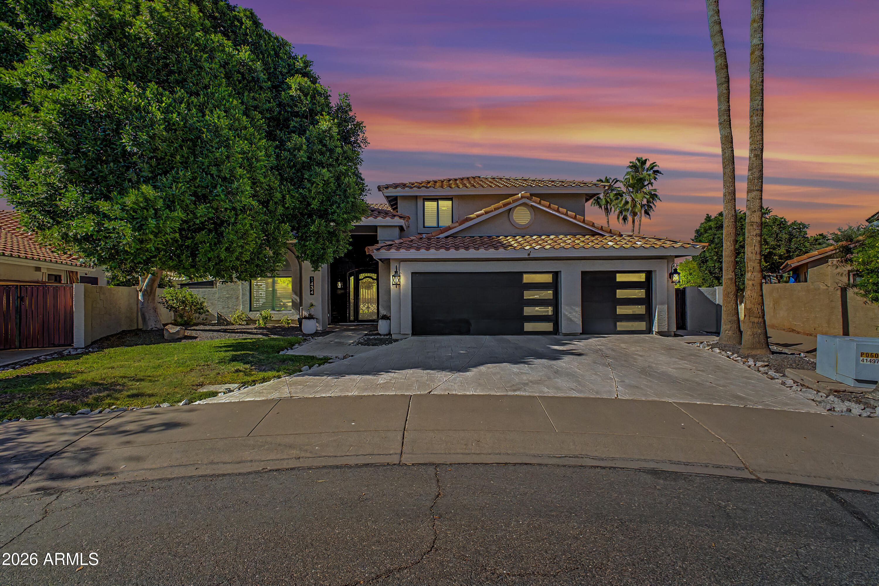 1434 West Key Harbor Drive Gilbert, AZ 85233 - Photo 37 of 144 a front view of a house with a yard and garage