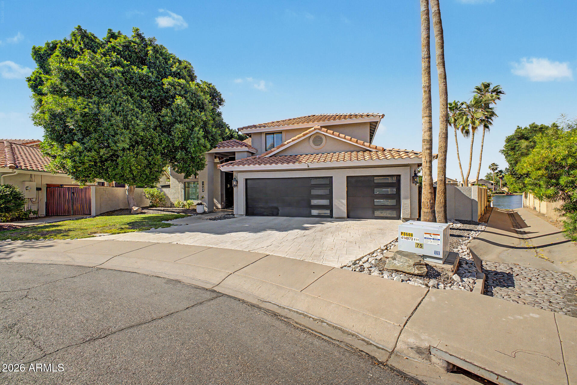 1434 West Key Harbor Drive Gilbert, AZ 85233 - Photo 4 of 144 a front view of a house with a yard