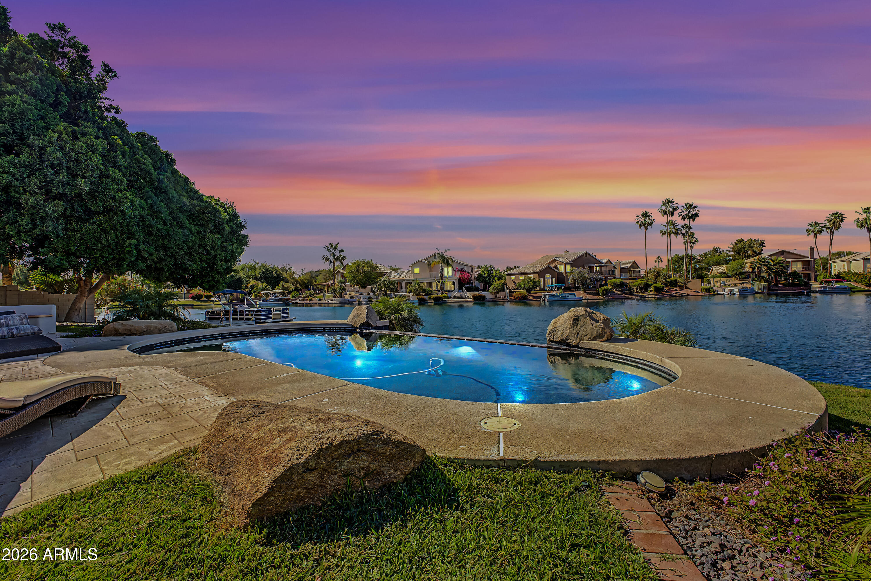 1434 West Key Harbor Drive Gilbert, AZ 85233 - Photo 43 of 144 a view of a swimming pool with a table and chairs