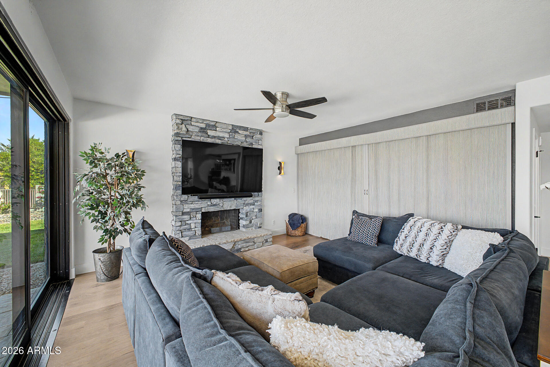 1434 West Key Harbor Drive Gilbert, AZ 85233 - Photo 50 of 144 a living room with furniture and a flat screen tv