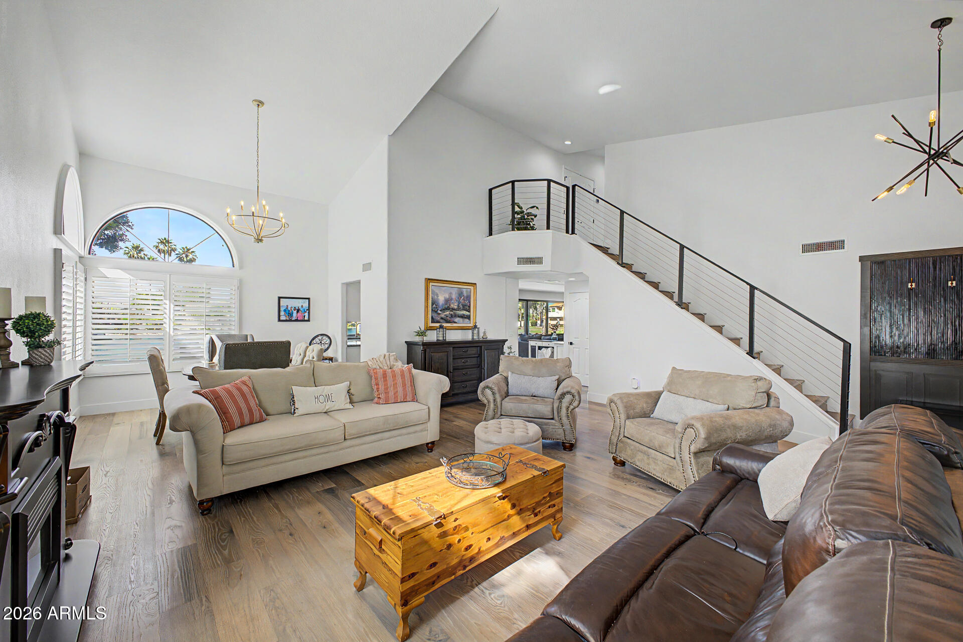1434 West Key Harbor Drive Gilbert, AZ 85233 - Photo 51 of 144 a living room with furniture a fireplace and a chandelier