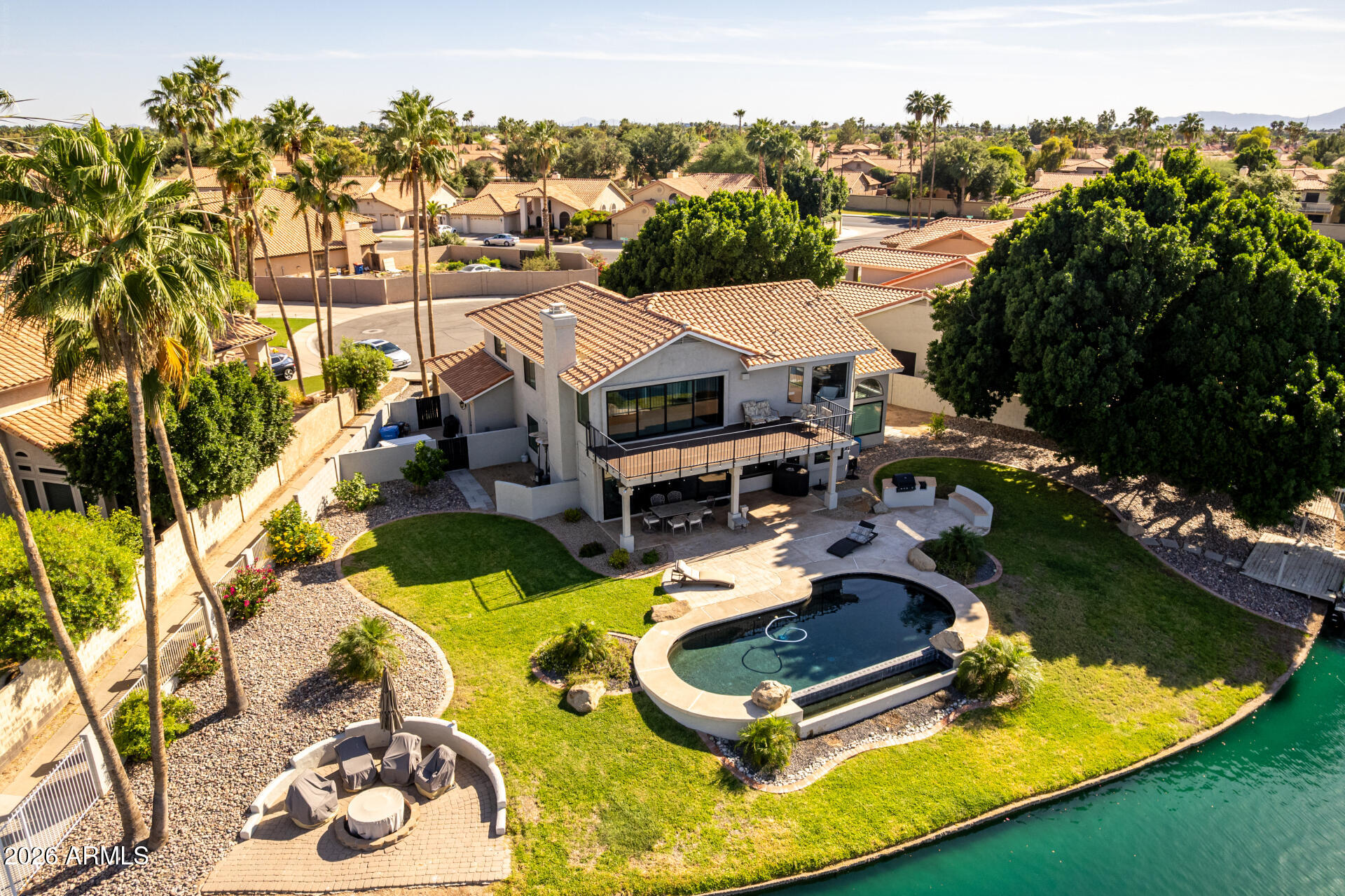 1434 West Key Harbor Drive Gilbert, AZ 85233 - Photo 7 of 144 an aerial view of a house with swimming pool and trees