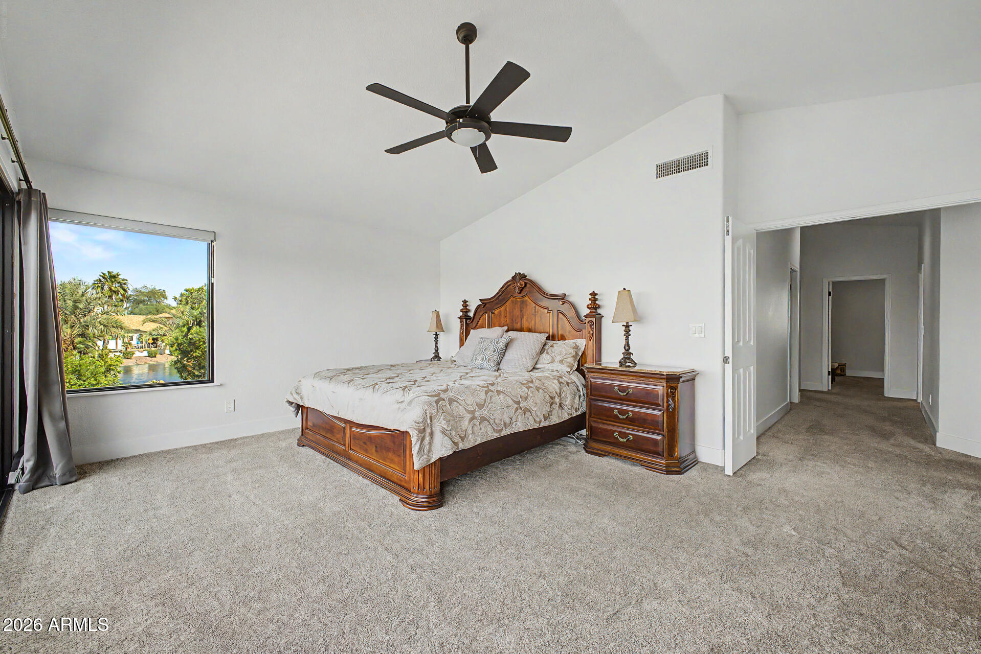 1434 West Key Harbor Drive Gilbert, AZ 85233 - Photo 72 of 144 a bedroom with a bed and a chandelier