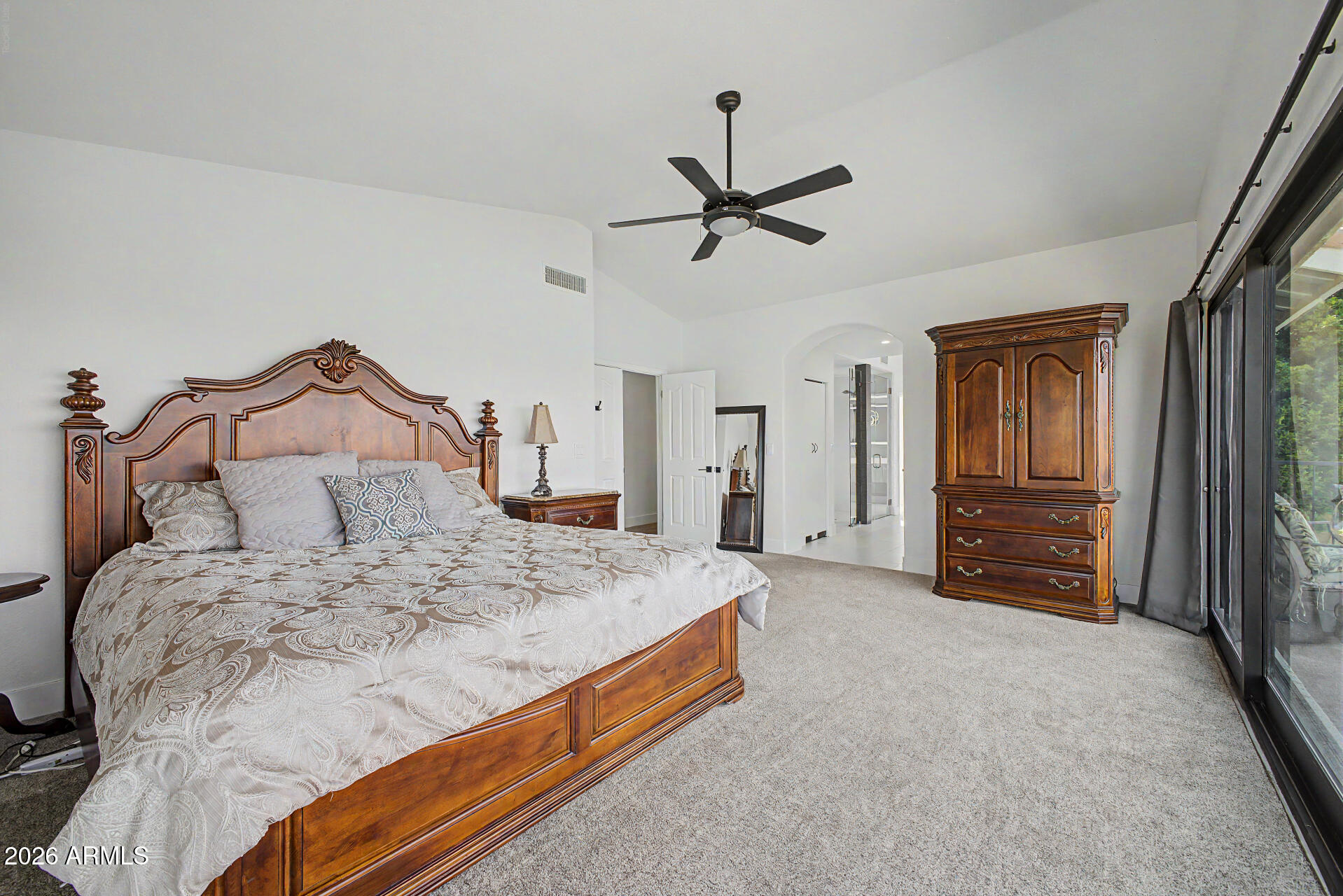 1434 West Key Harbor Drive Gilbert, AZ 85233 - Photo 73 of 144 a spacious bedroom with a bed a dresser and a chandelier