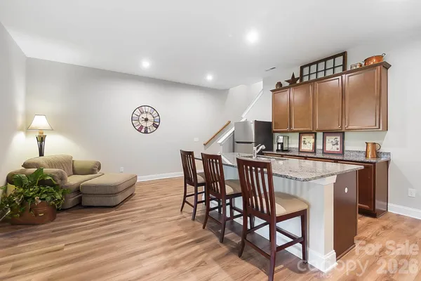 a view of a livingroom with furniture and wooden floor
