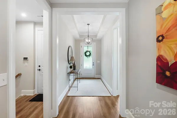 a view of entryway with wooden floor
