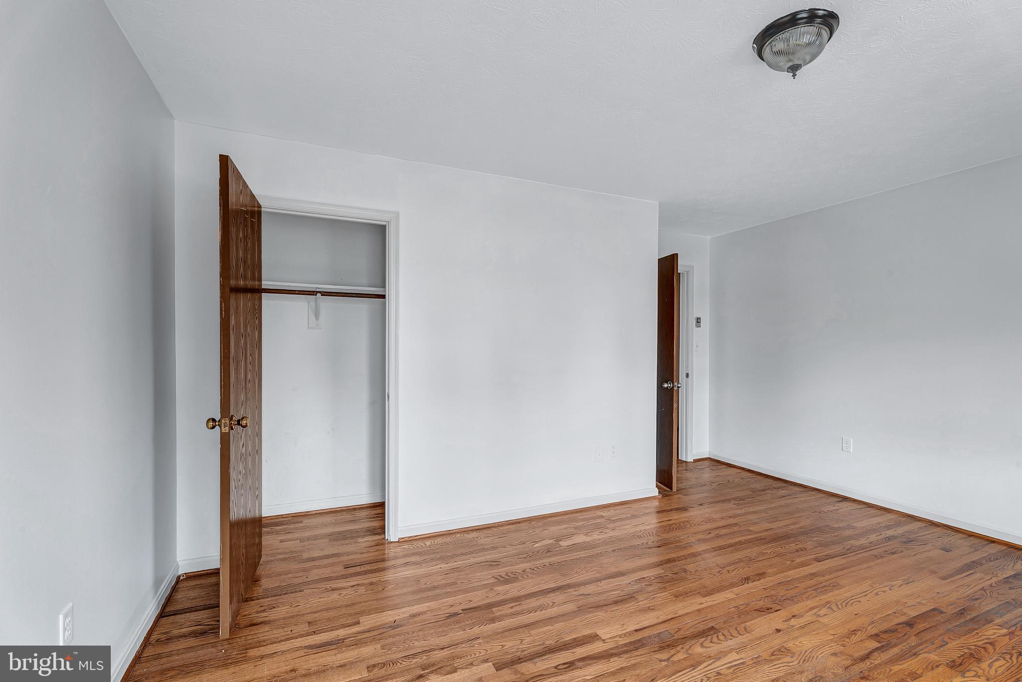 210 Brunswick Road Stephens City, VA 22655 - Photo 14 of 18 a view of an empty room with wooden floor