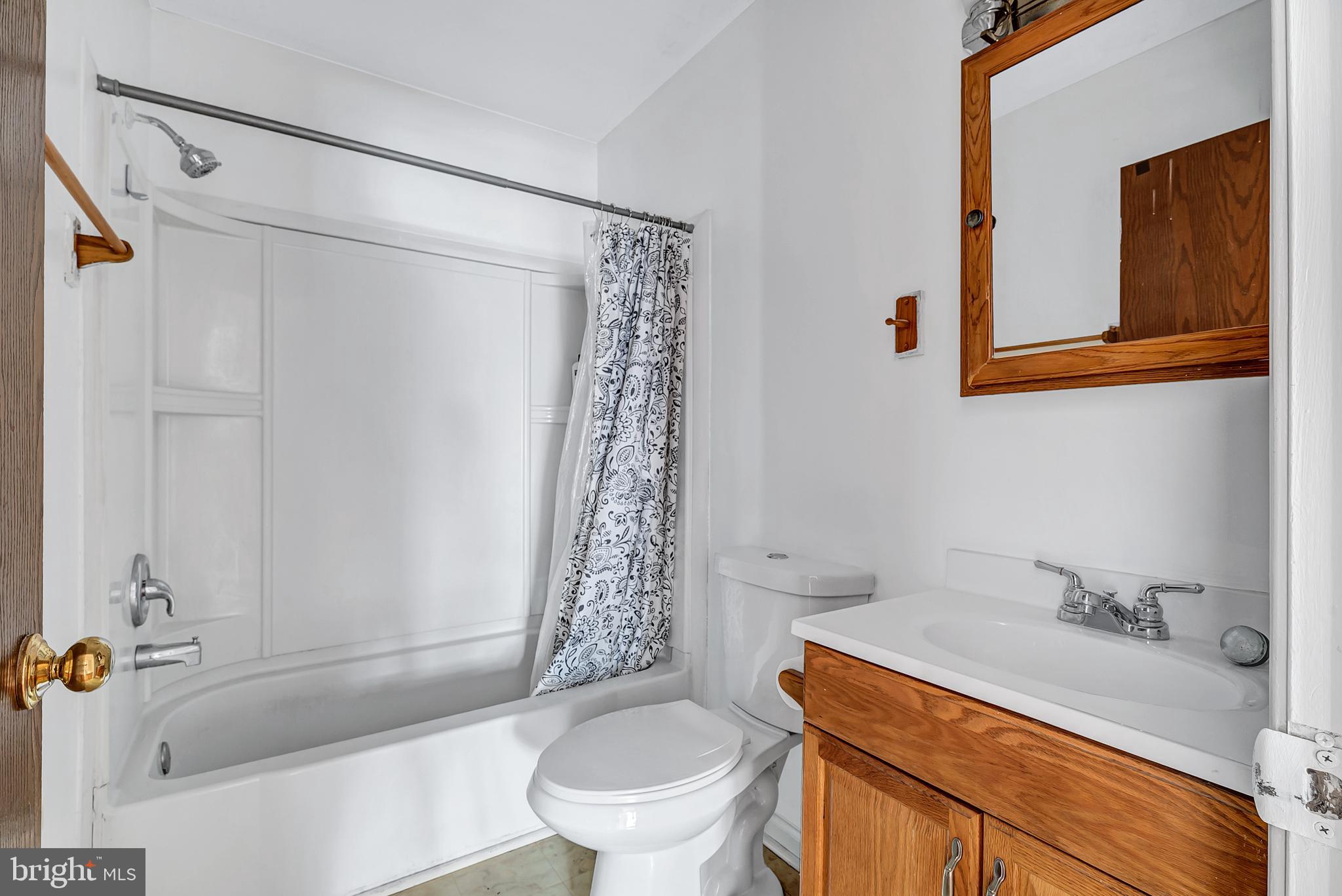 210 Brunswick Road Stephens City, VA 22655 - Photo 16 of 18 a bathroom with a sink a toilet and shower