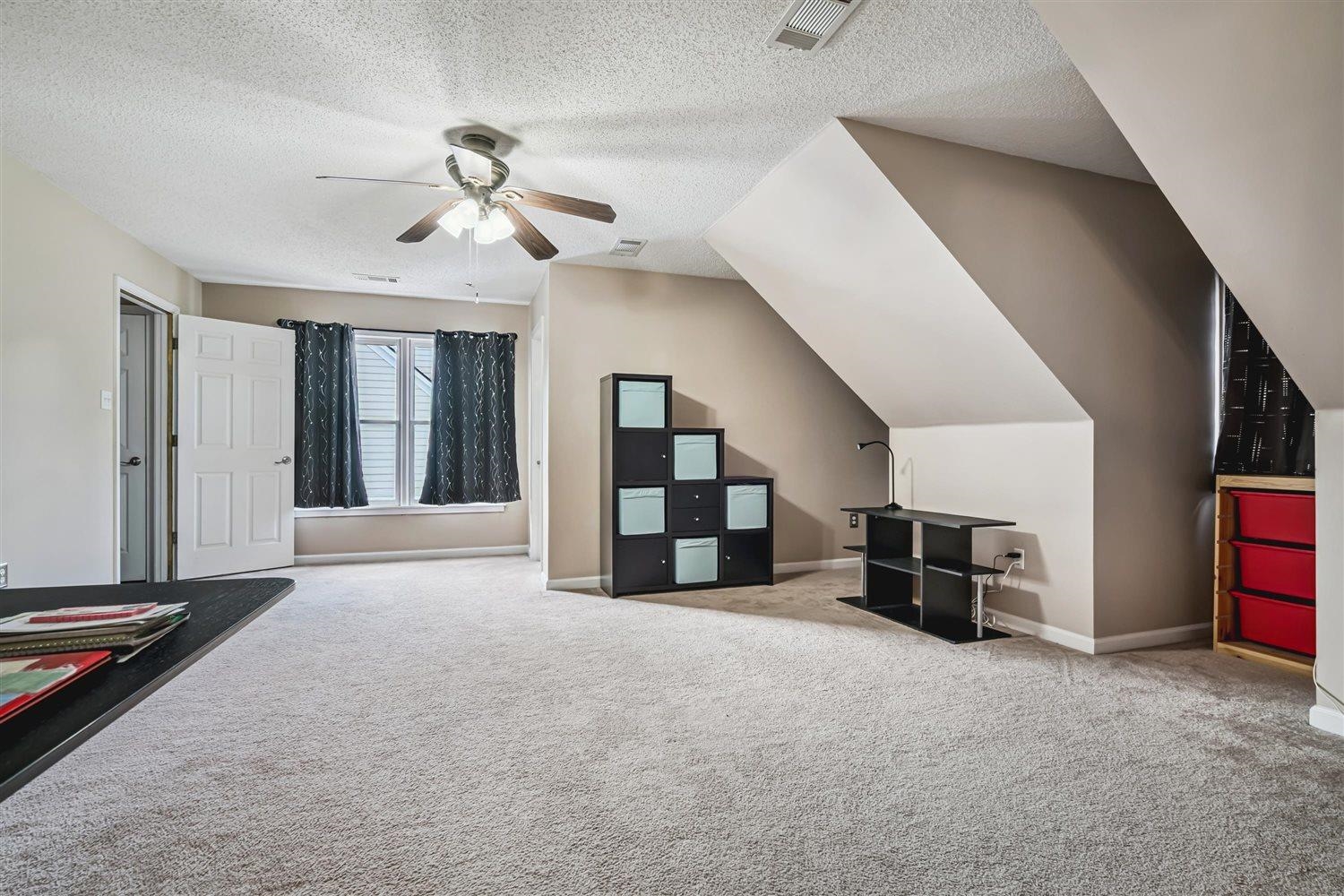 1489 John Ridge Drive Collierville, TN 38017 - Photo 33 of 39 a view of a livingroom with furniture and a ceiling fan