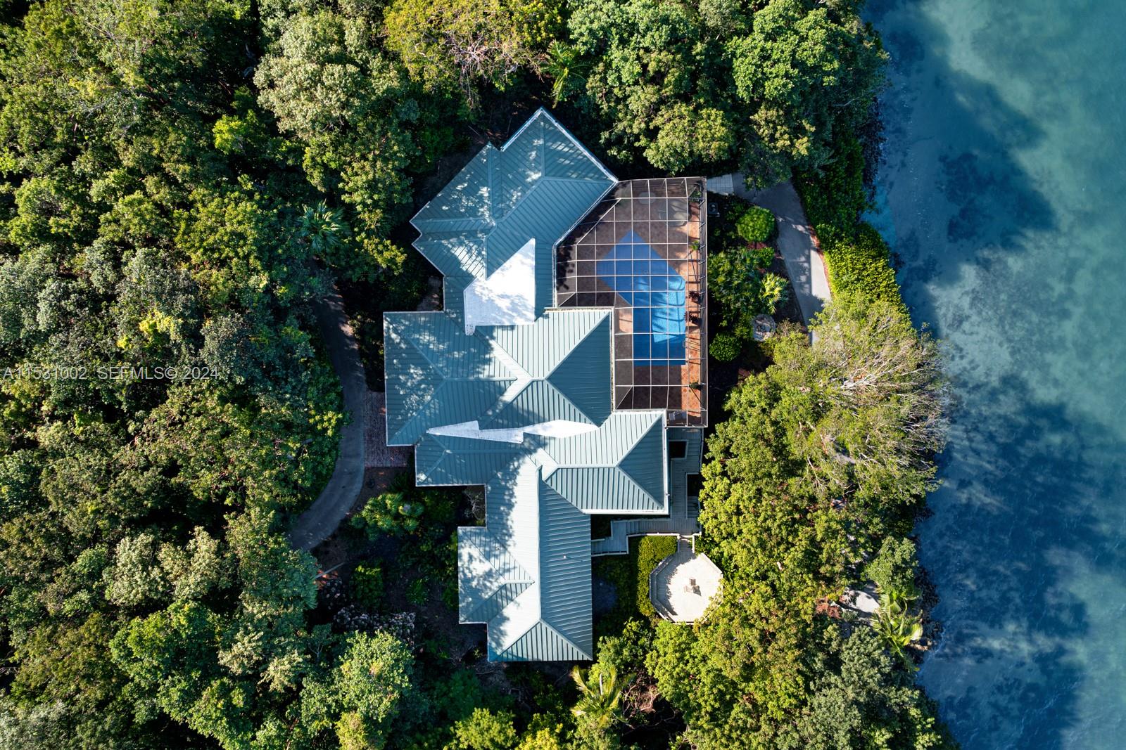 10 Cannon Point Key Largo, FL 33037 - Photo 18 of 29 an aerial view of a house with a yard and garden