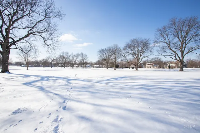 a front view of a house with a road