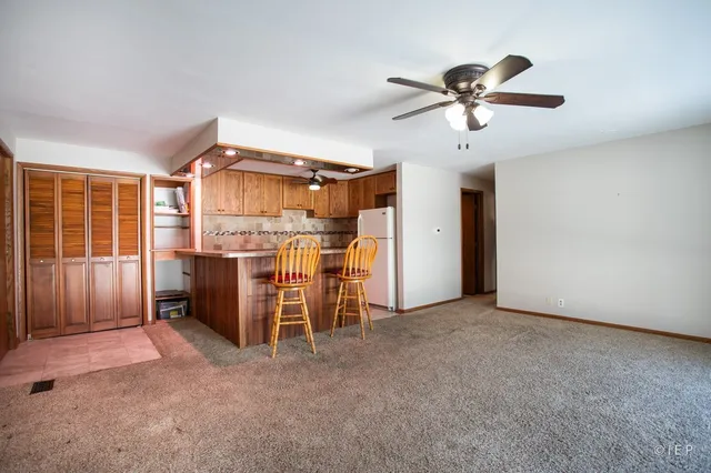 a kitchen with granite countertop a sink stainless steel appliances and cabinets