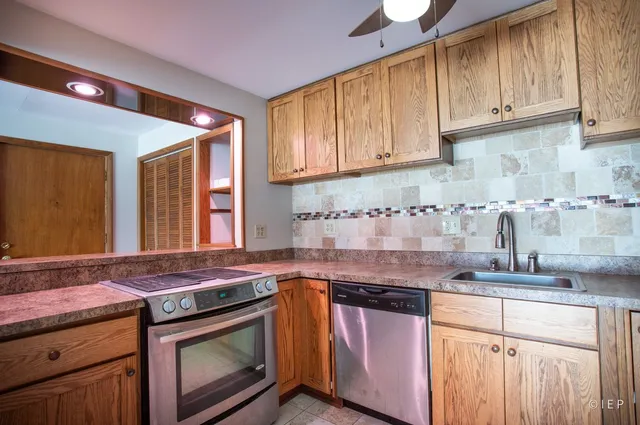 a kitchen with a stove and a sink