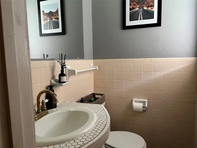 a bathroom with a toilet and a sink