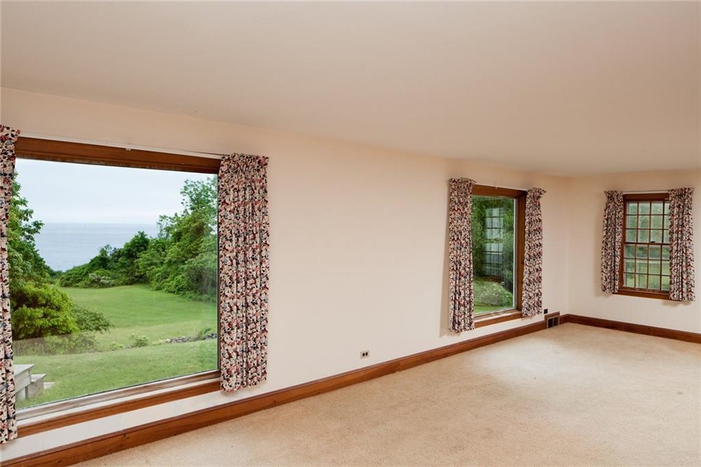 755 Shore Road Cape Neddick, ME 03902 - Photo 9 of 35 The living room windows frame the view.