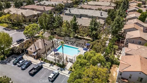 an aerial view of a house with yard swimming pool and outdoor seating
