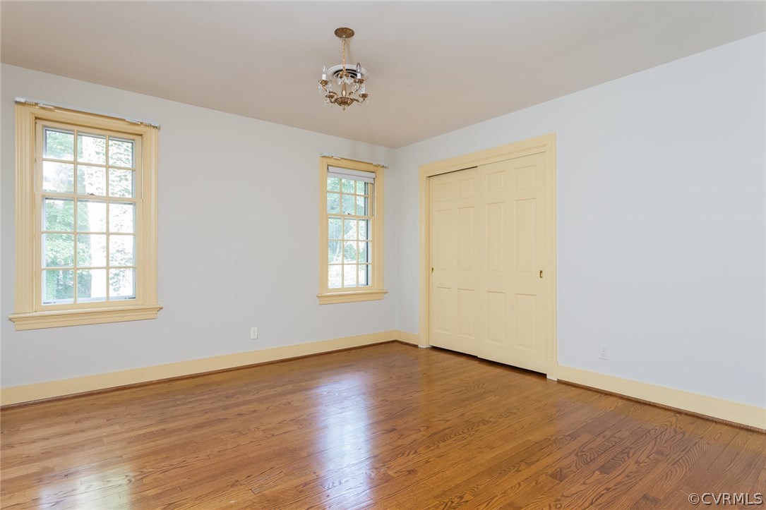 2420 Wadebridge Road Midlothian, VA 23113 - Photo 44 of 50 a view of an empty room with wooden floor and a window