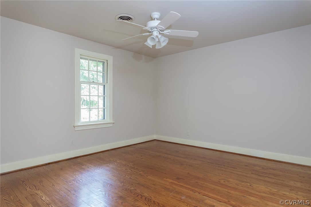 2420 Wadebridge Road Midlothian, VA 23113 - Photo 46 of 50 an empty room with wooden floor and windows