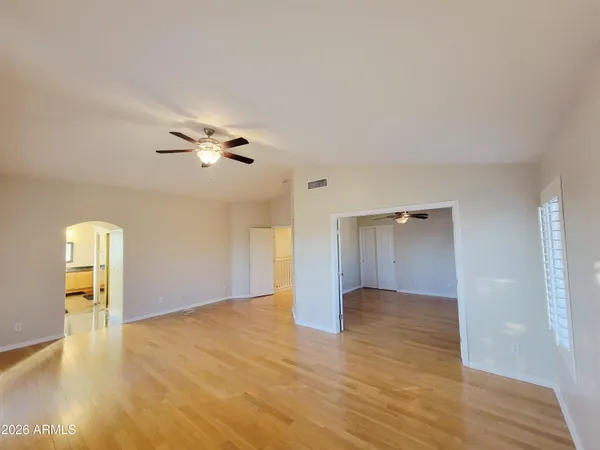 a view of an empty room and wooden floor