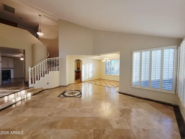 a view of an empty room with glass door