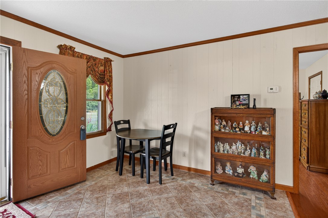 145 State Rd S-4-935 Pendleton, SC 29670 - Photo 44 of 47 A welcoming entryway with natural light, featuring tile flooring and a decorative glass front door.