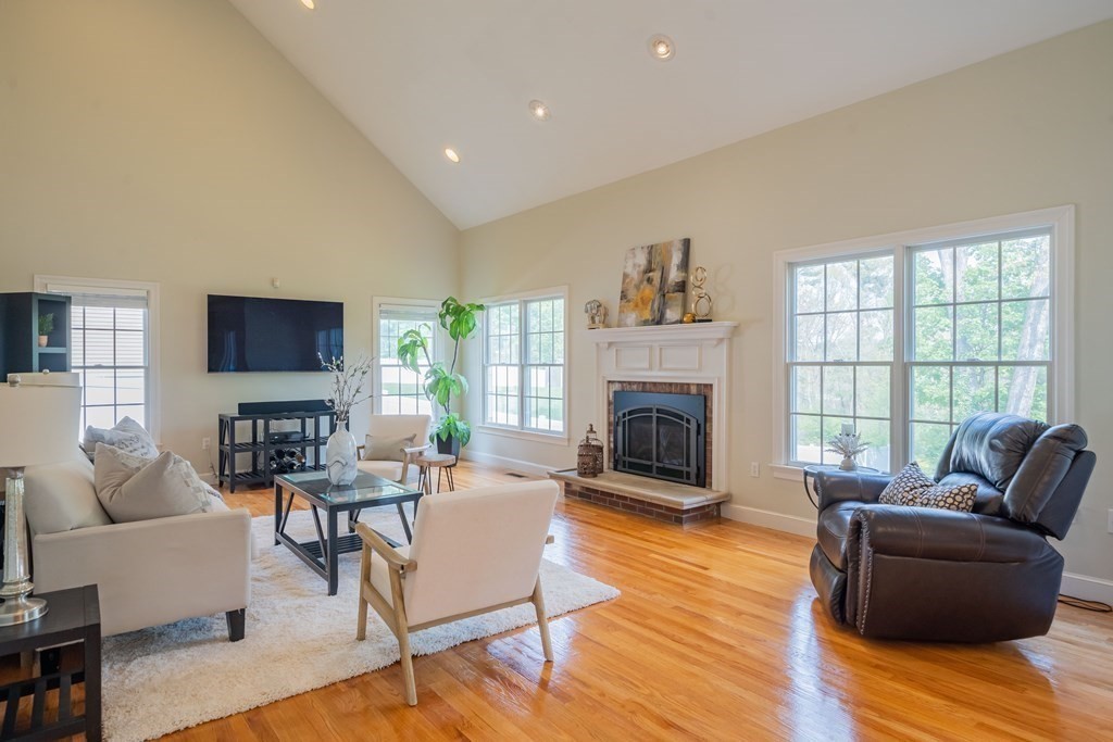 9 Bates Road Lexington, MA 02421 - Photo 20 of 42 a living room with furniture and a fireplace