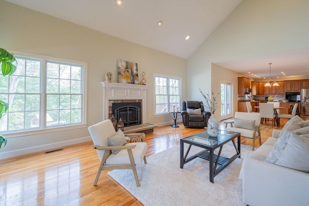 9 Bates Road Lexington, MA 02421 - Photo 23 of 42 a living room with furniture and a fireplace