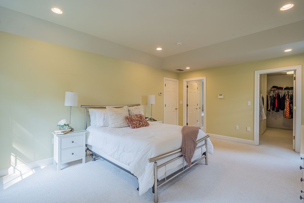 9 Bates Road Lexington, MA 02421 - Photo 30 of 42 a spacious bedroom with a bed and a lamp